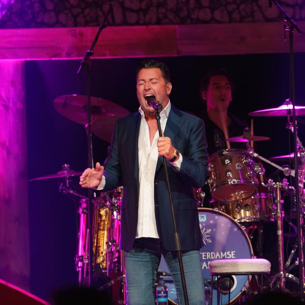 Singer and band in purple light